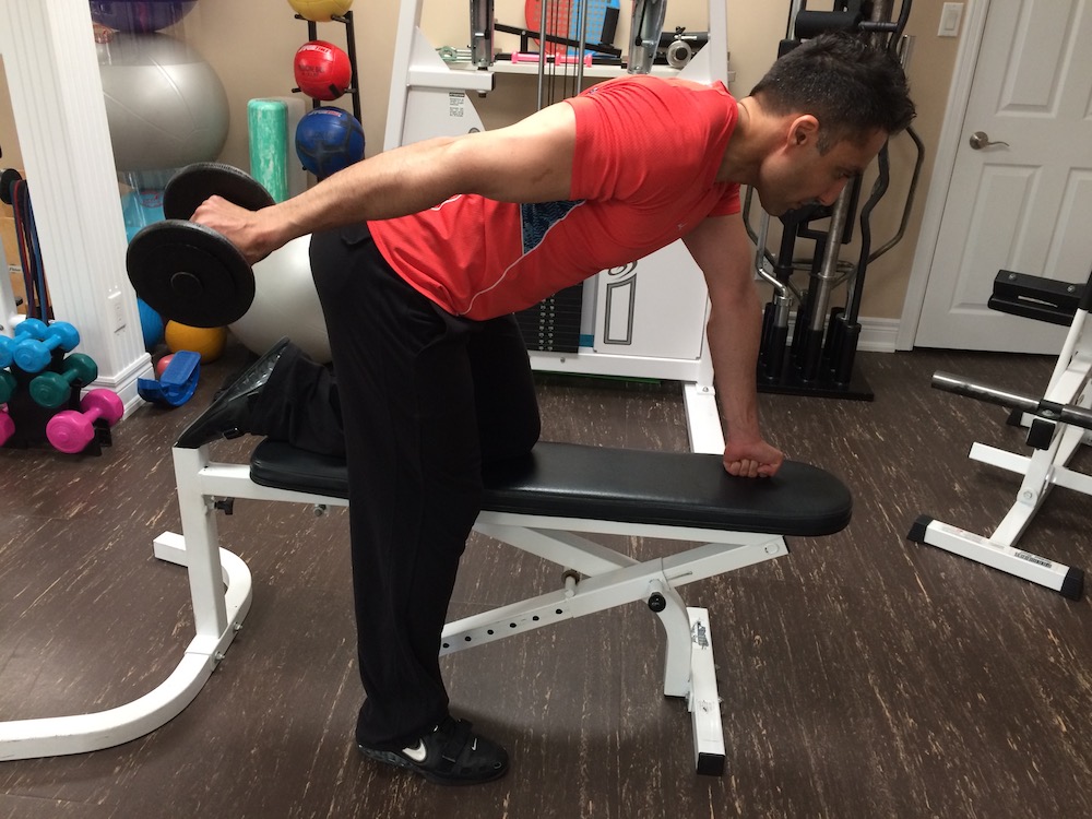 supinated dumbbell kickback end position
